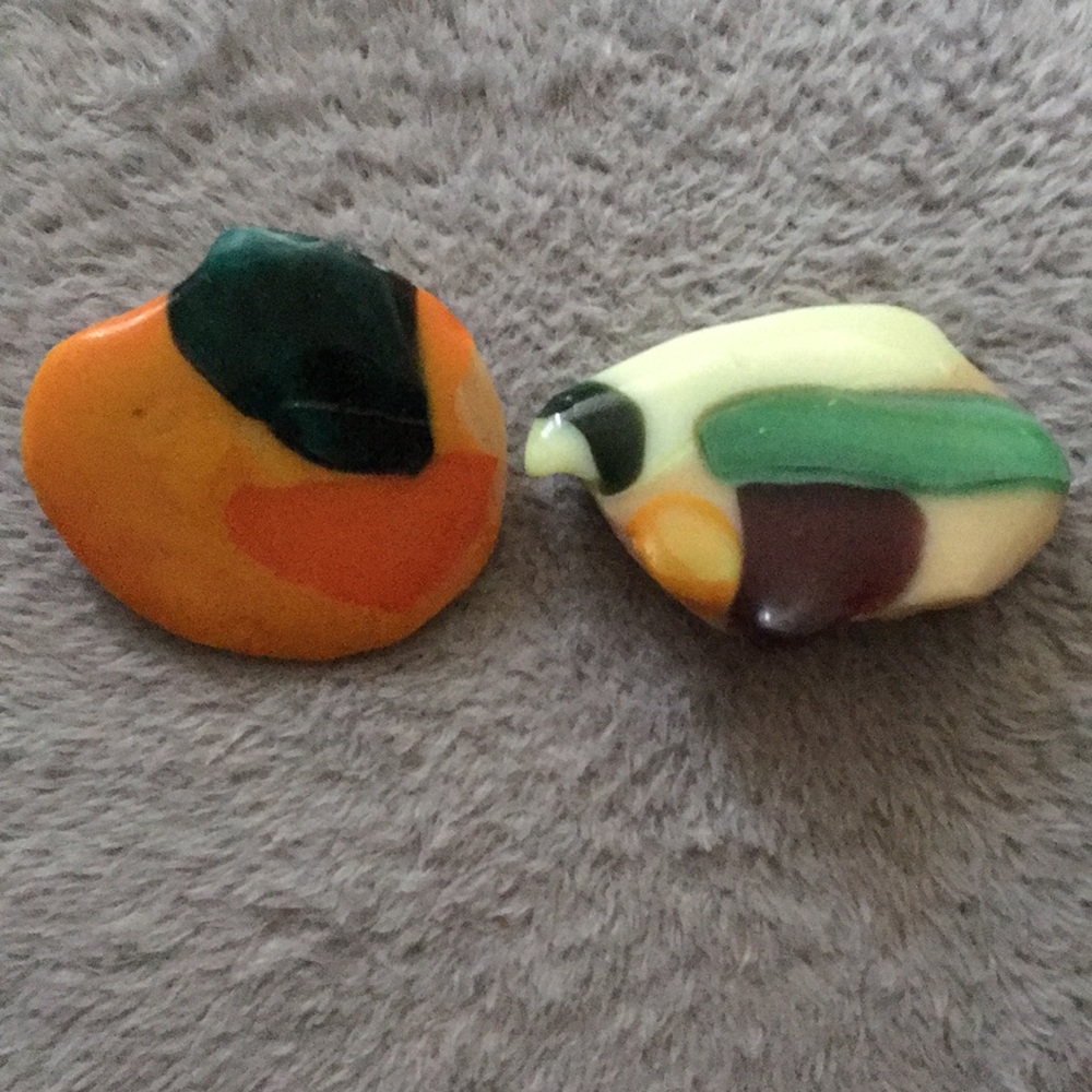 A bundle of 2 pins and a pair of clip-on earrings